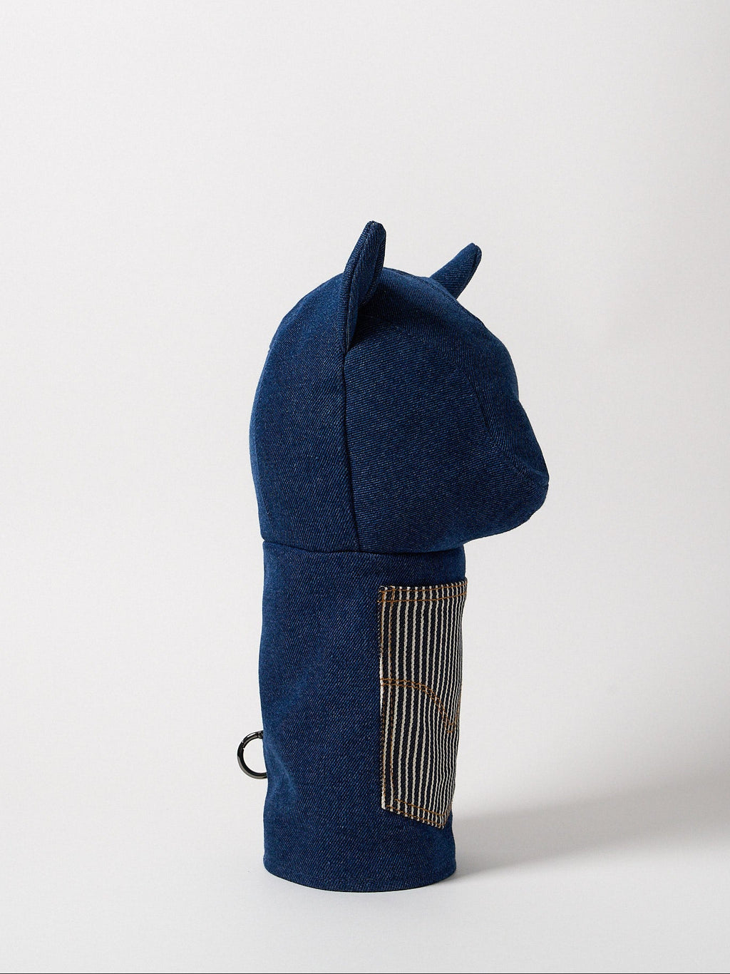 Profile view of a premium heavy-weight indigo denim driver headcover featuring artisanal top-stitching and a functional front utility pocket.