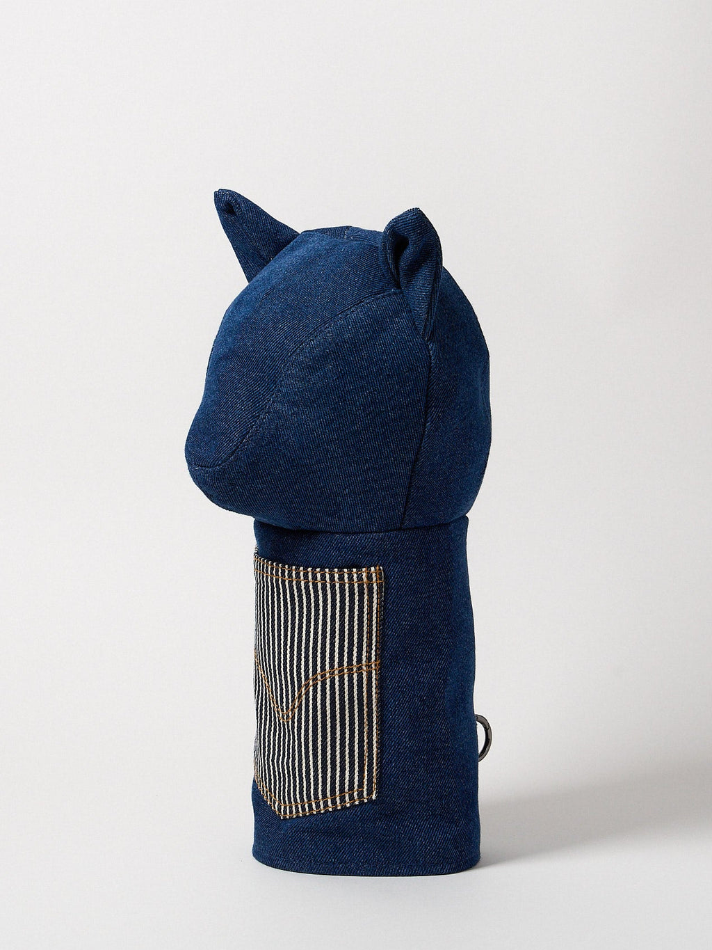 Profile view of a premium heavy-weight indigo denim driver headcover featuring artisanal top-stitching and a functional front utility pocket.