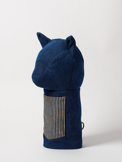 Profile view of a premium heavy-weight indigo denim driver headcover featuring artisanal top-stitching and a functional front utility pocket.