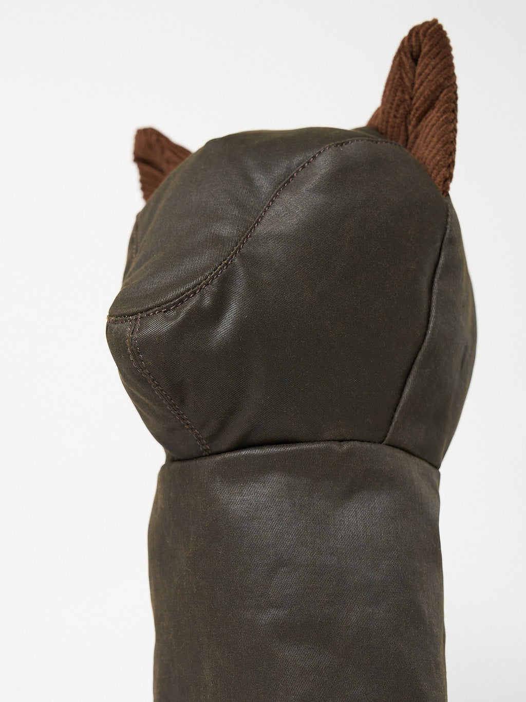 Structured Barbour-style waxed cotton golf driver headcover with textured corduroy ear accents.