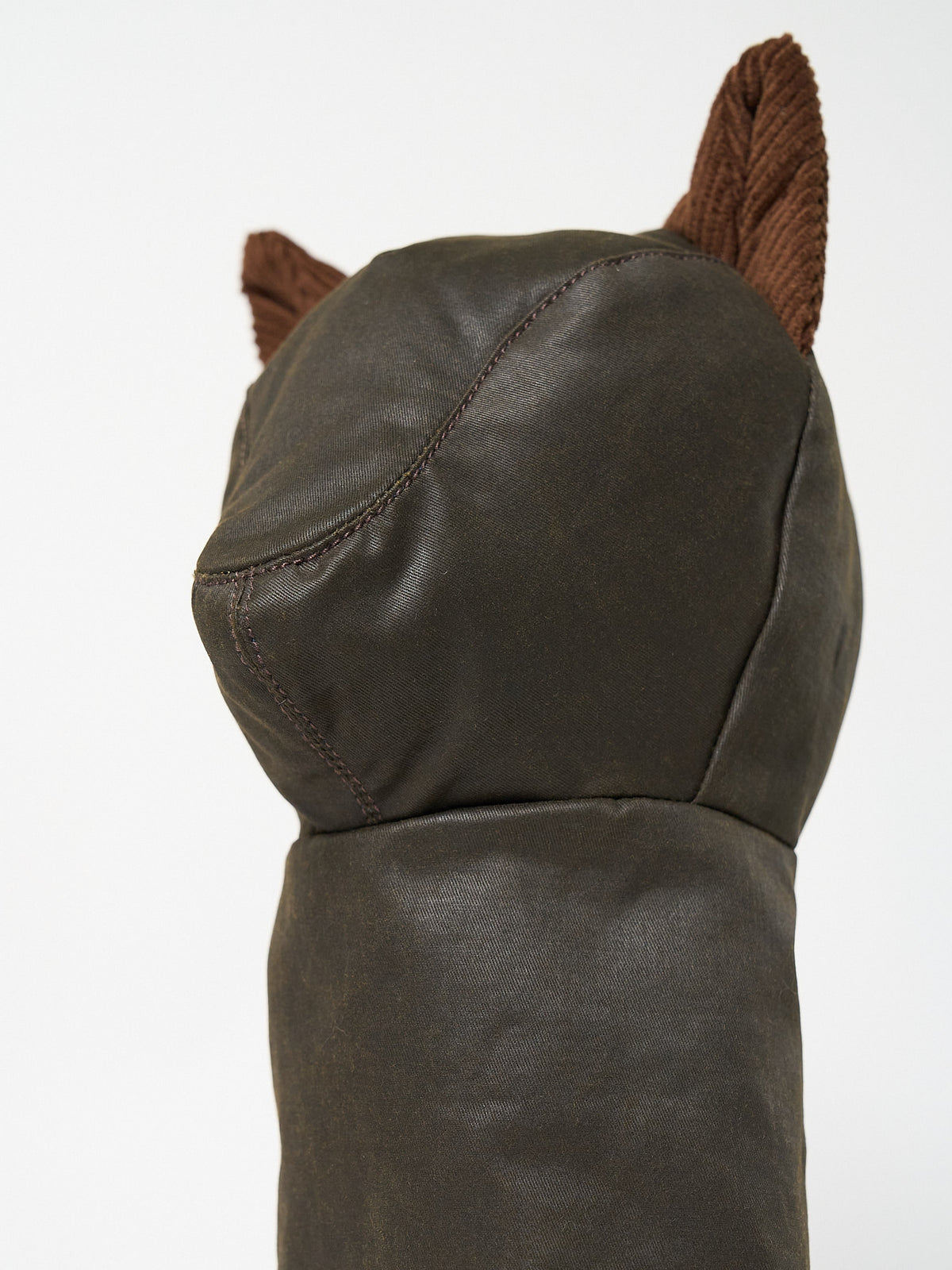 Structured Barbour-style waxed cotton golf driver headcover with textured corduroy ear accents.