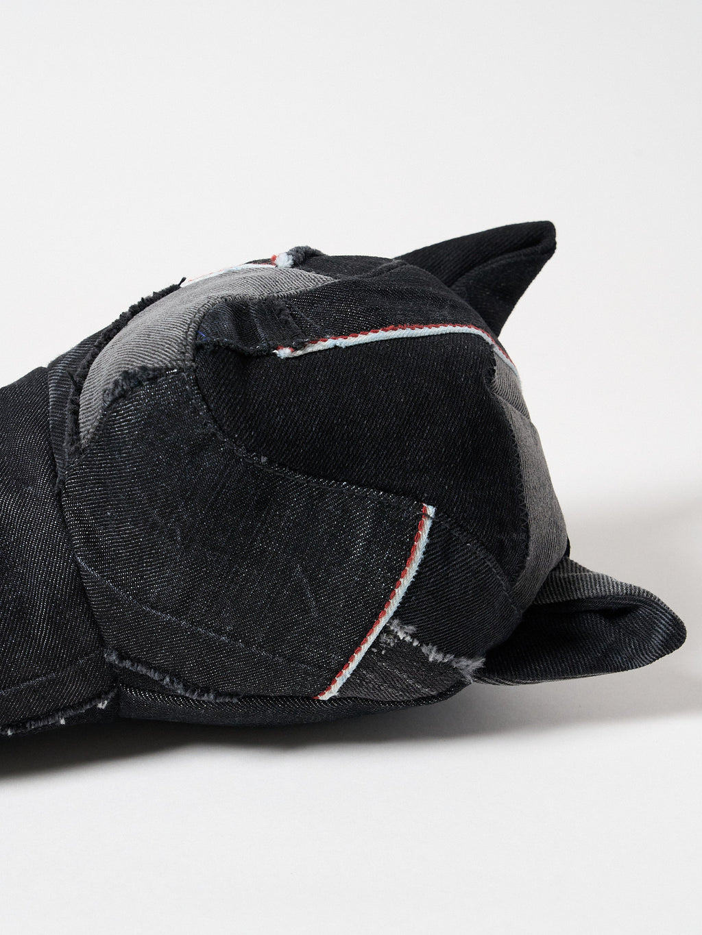 detail view of a premium black Sashiko denim golf driver headcover featuring traditional Japanese reinforced stitching