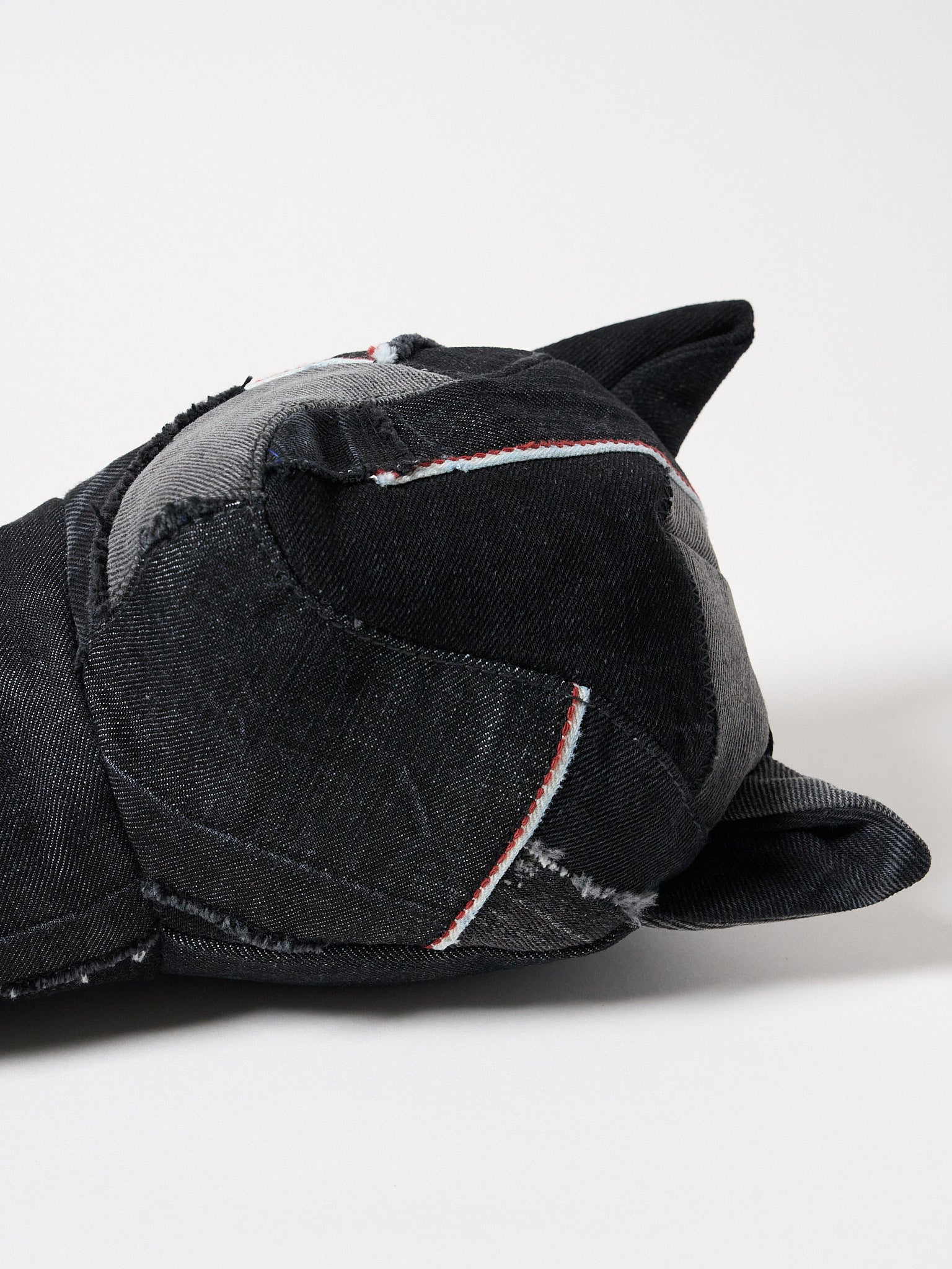 detail view of a premium black Sashiko denim golf driver headcover featuring traditional Japanese reinforced stitching