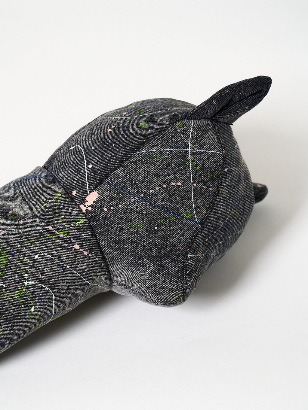 Structured dark gray denim golf driver headcover featuring an abstract Jackson Pollock-inspired paint-splatter design.