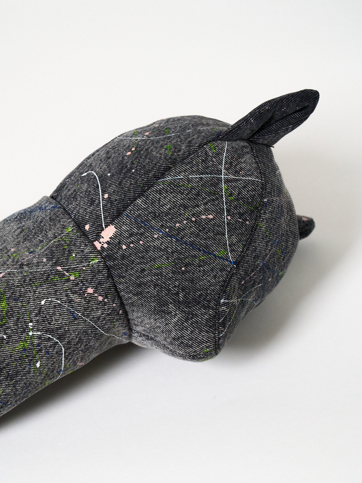 Structured dark gray denim golf driver headcover featuring an abstract Jackson Pollock-inspired paint-splatter design.