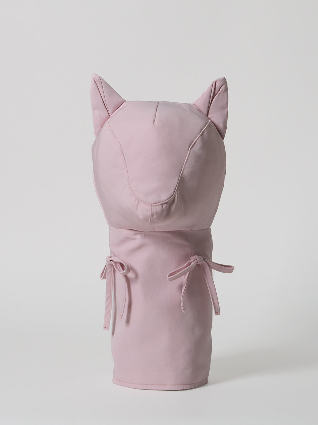 A high-performance golf driver headcover made from smooth, satin-textured nylon fabric with two playful pink ribbons sewn onto the front.