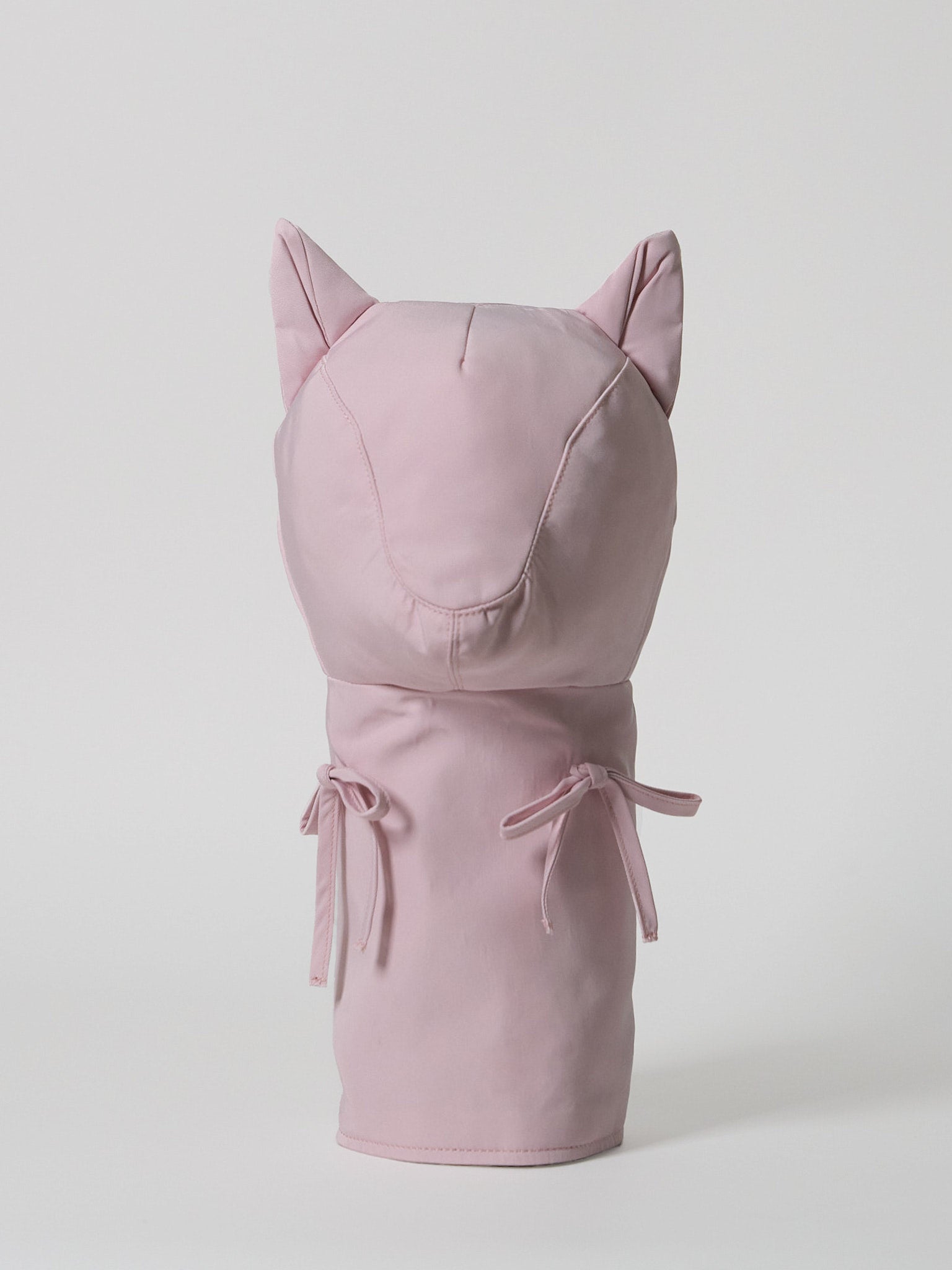 A high-performance golf driver headcover made from smooth, satin-textured nylon fabric with two playful pink ribbons sewn onto the front.