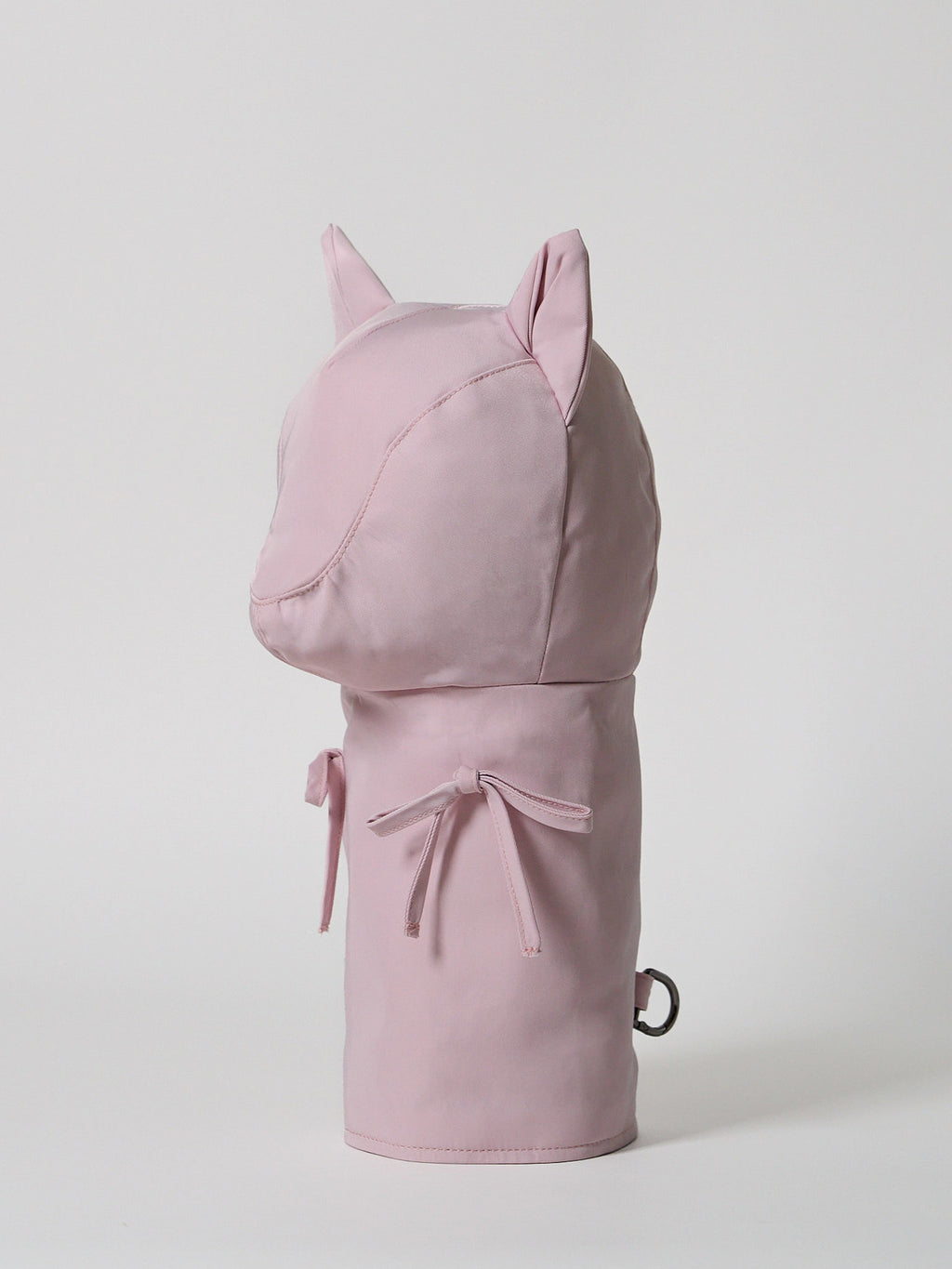 A high-performance golf driver headcover made from smooth, satin-textured nylon fabric with two playful pink ribbons sewn onto the front.