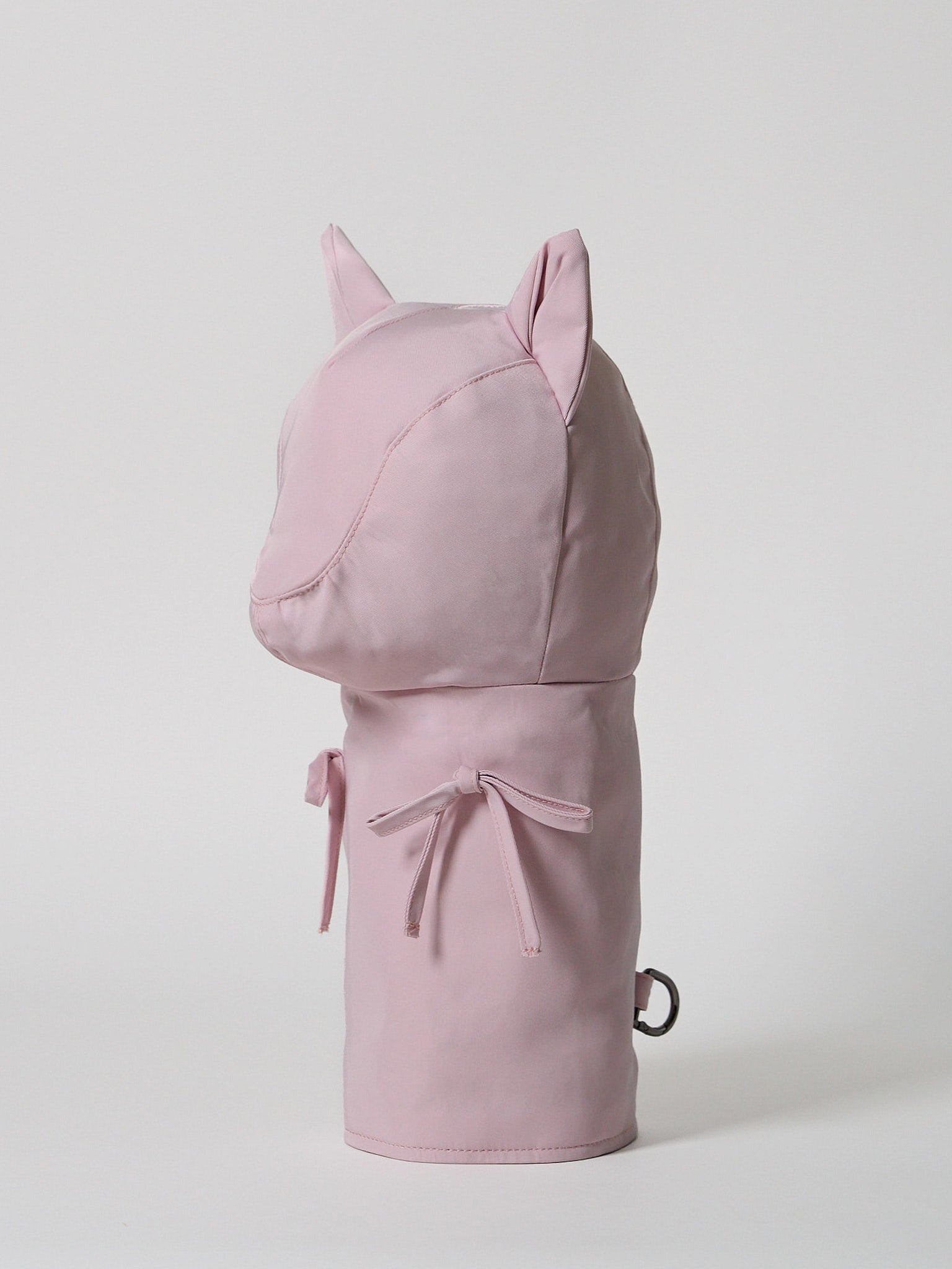 A high-performance golf driver headcover made from smooth, satin-textured nylon fabric with two playful pink ribbons sewn onto the front.
