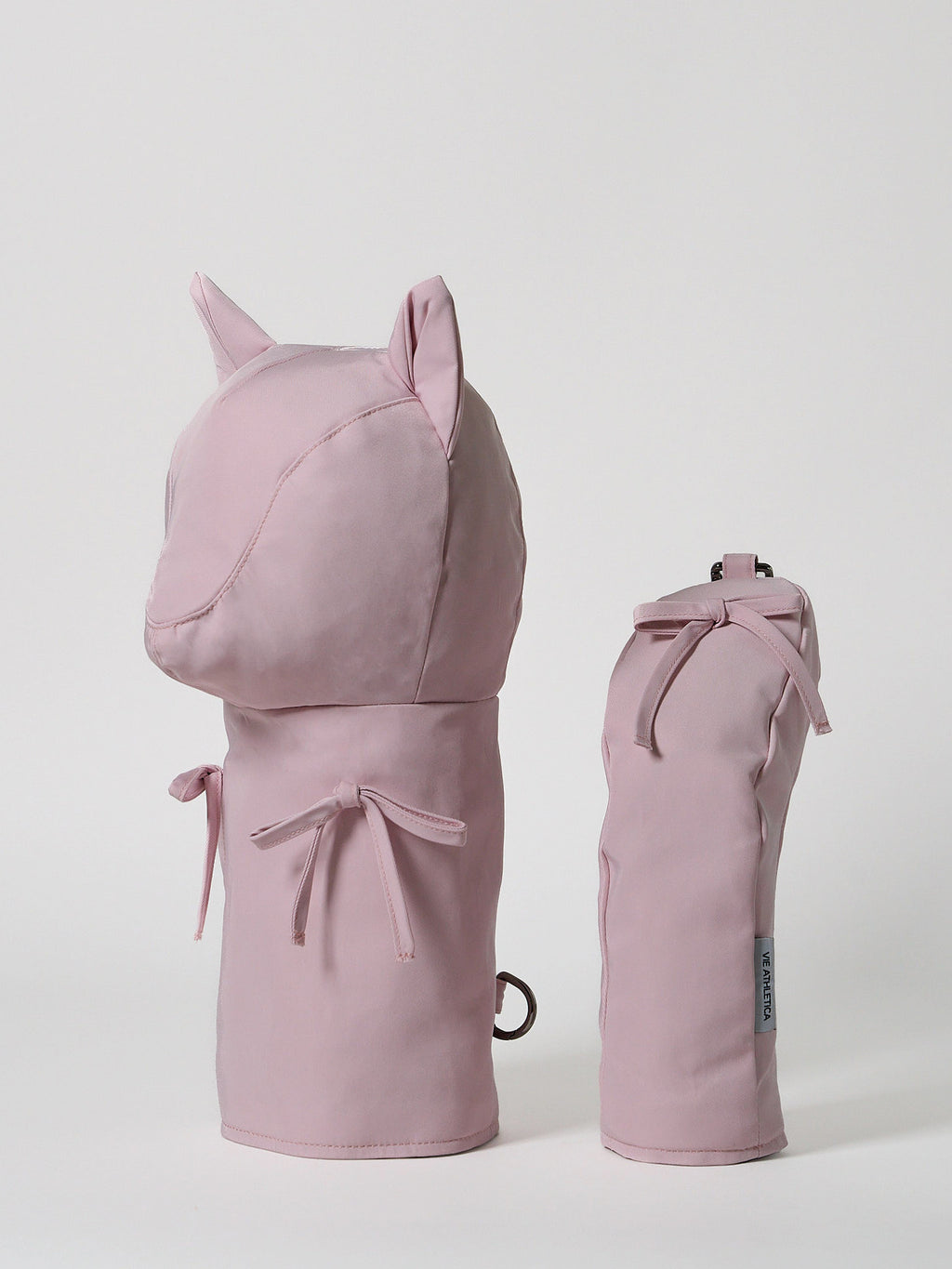 Structured pink nylon golf hybrid headcover featuring a decorative ribbon accent and a solid brass D-ring buckle.