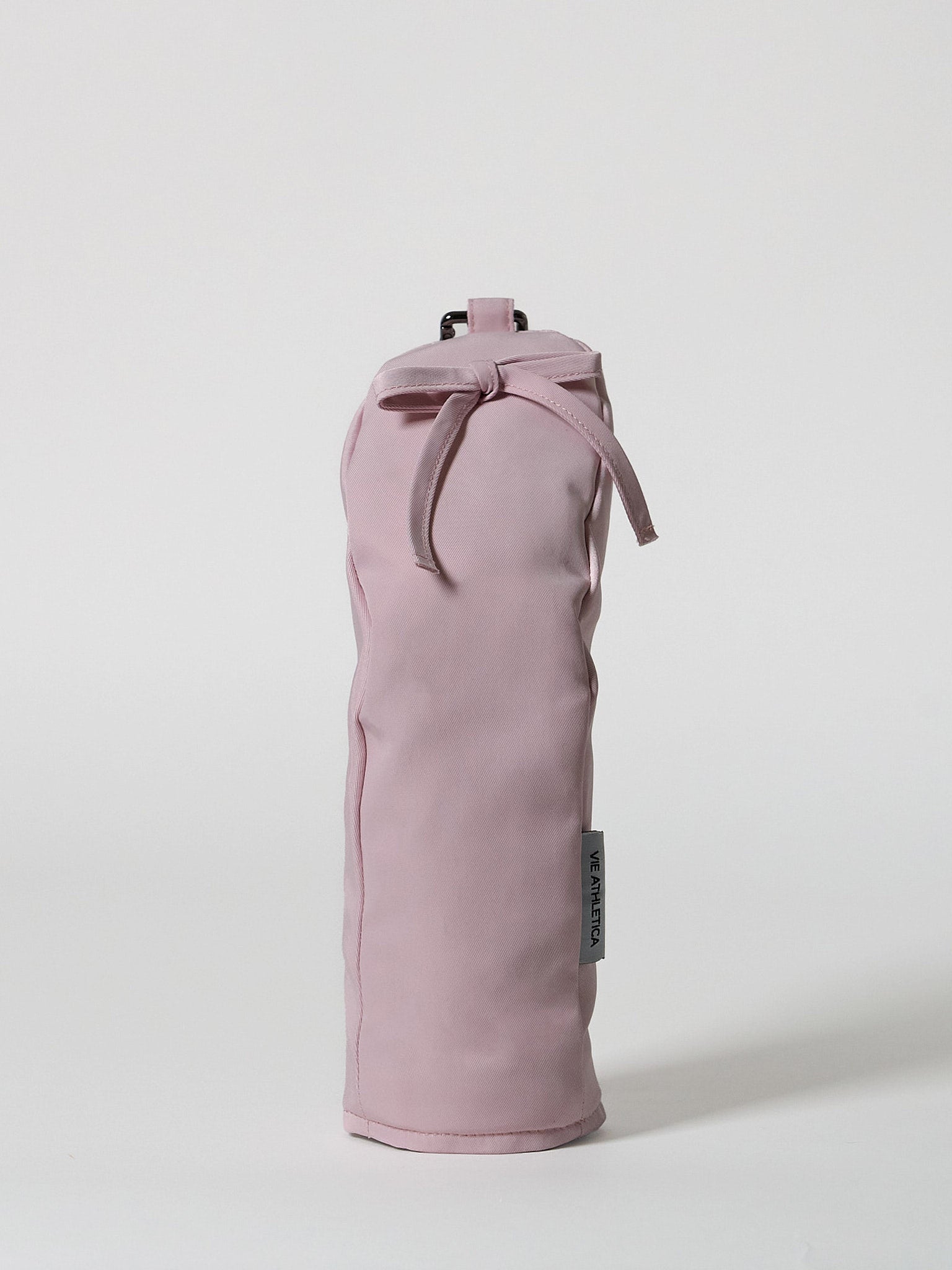 Structured pink nylon golf hybrid headcover featuring a decorative ribbon accent and a solid brass D-ring buckle.