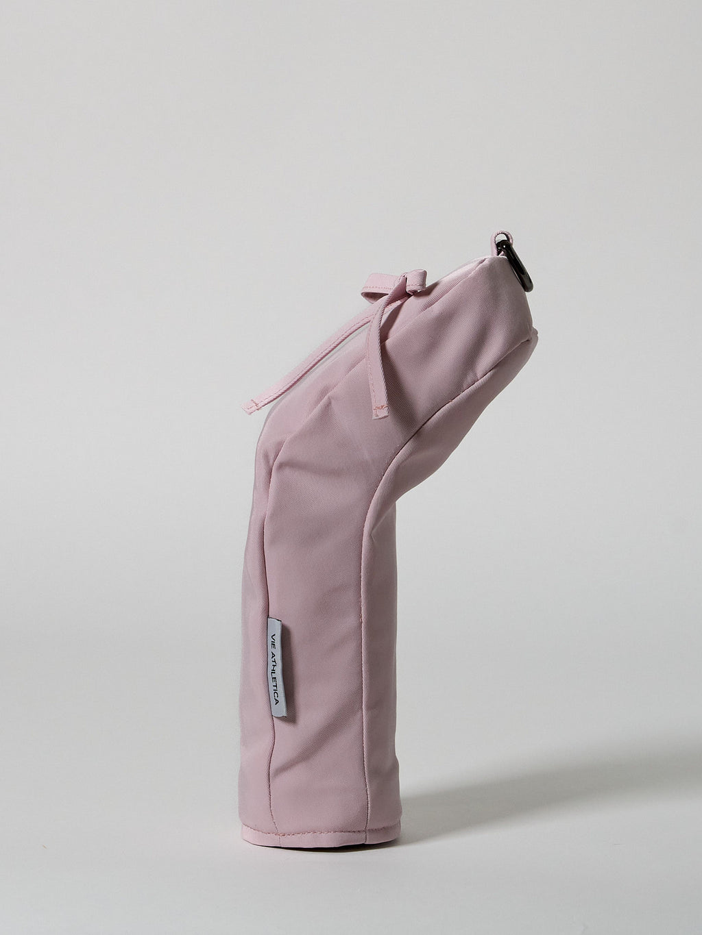 Structured pink nylon golf hybrid headcover featuring a decorative ribbon accent and a solid brass D-ring buckle.