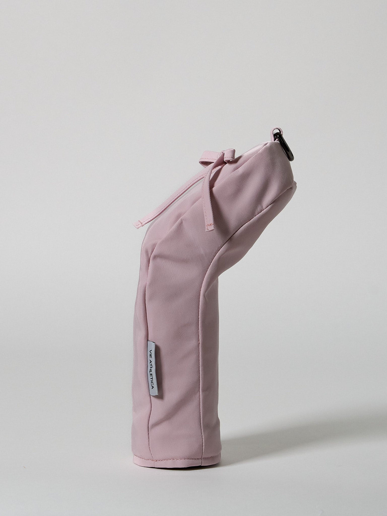 Structured pink nylon golf hybrid headcover featuring a decorative ribbon accent and a solid brass D-ring buckle.