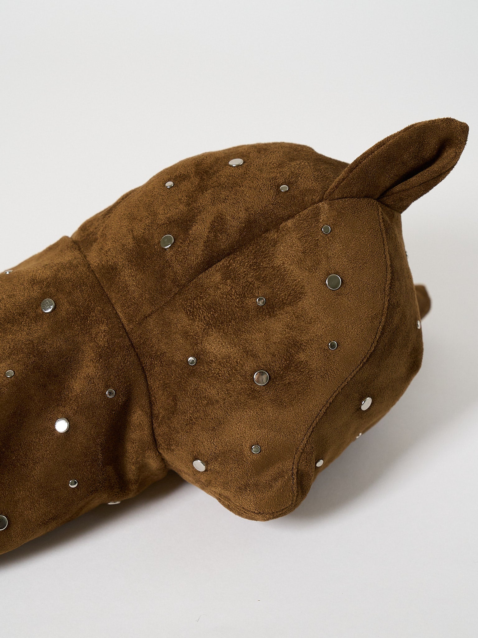 A premium structured golf headcover made from textured suede fabric and embellished with a decorative pattern of metal studs.
