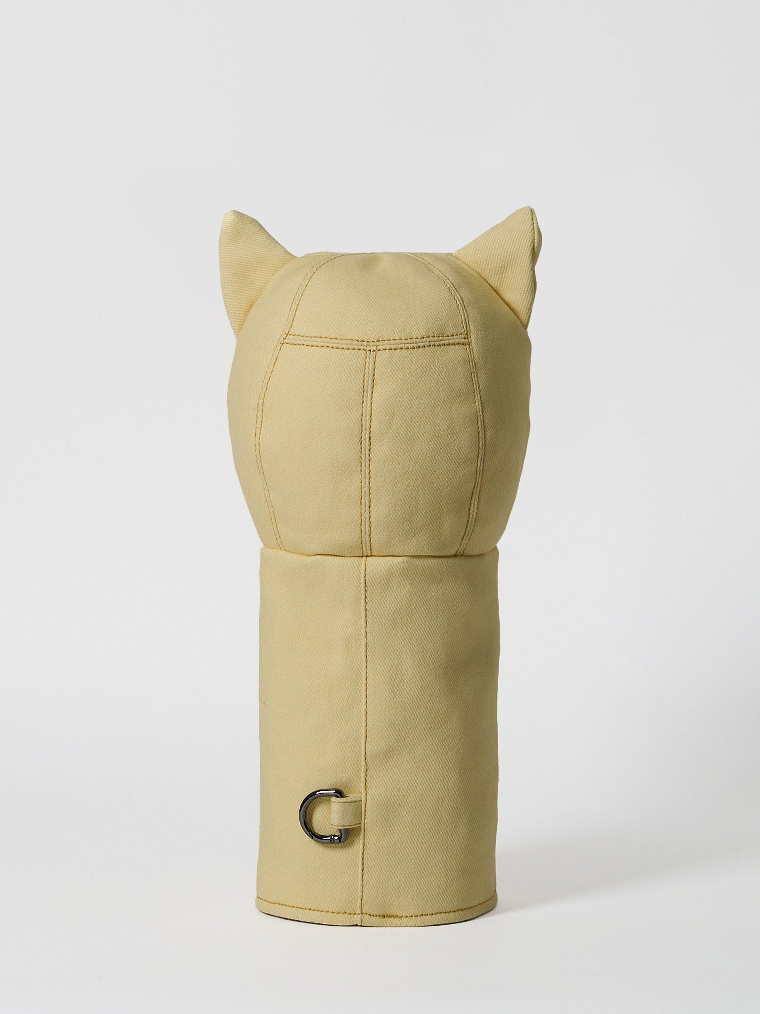 A structured golf driver headcover made from vibrant yellow denim, detailed with a playful mushroom patchwork design crafted from dark indigo denim.