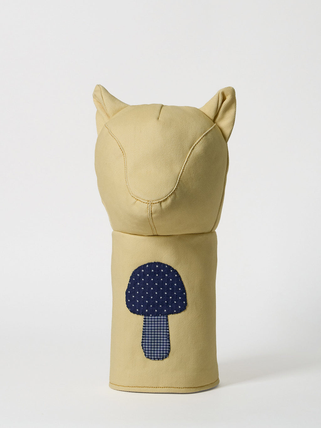 A structured golf driver headcover made from vibrant yellow denim, detailed with a playful mushroom patchwork design crafted from dark indigo denim.
